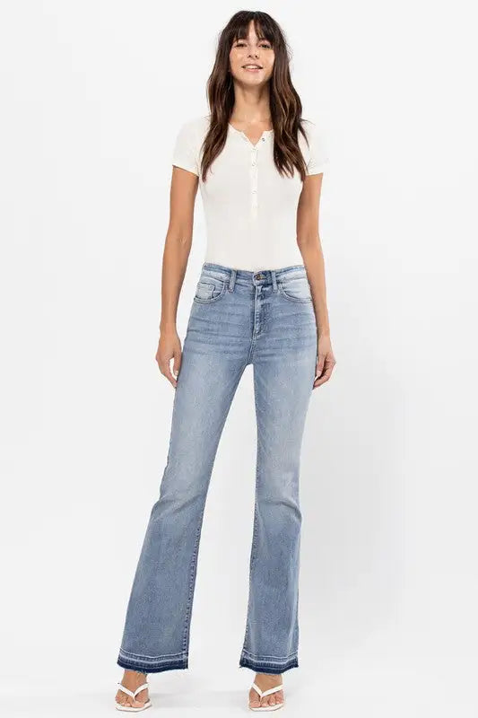 Women’s high rise flare jeans with raw cut hem and frayed bottom detail