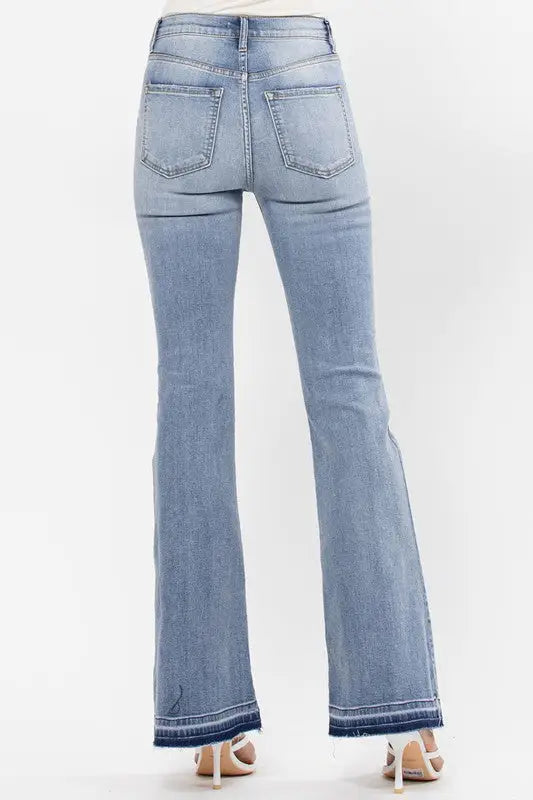 Light wash high rise flare jeans with raw cut hem and bottom detail