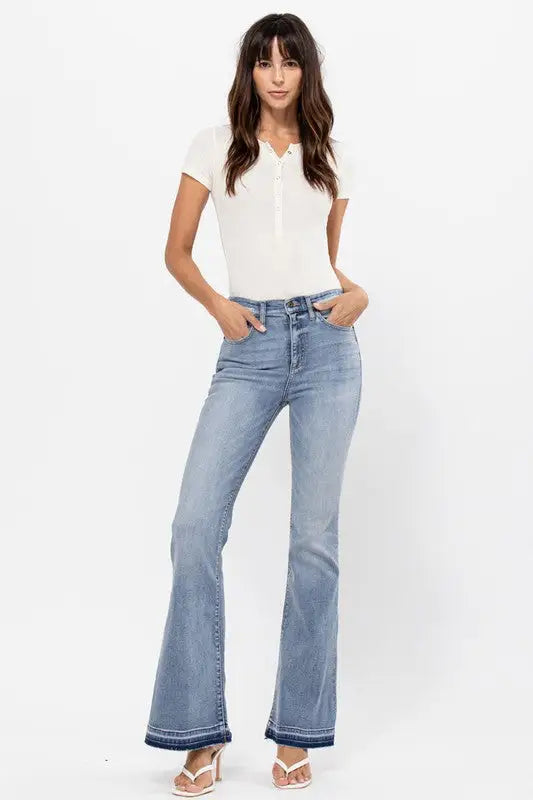 High rise flare jeans with raw cut hem and distressed light wash style