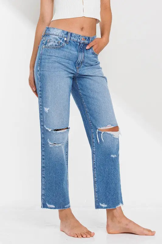 Light blue distressed high rise straight leg ankle jeans with ripped knees and raw hem