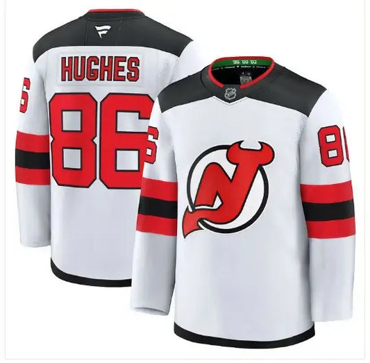 White New Jersey Devils hockey jersey with red and black accents, featuring Jack Hughes design