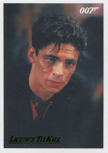 Portrait of a dark-haired man with 007 logo on James Bond Gold Parallel Chase Card