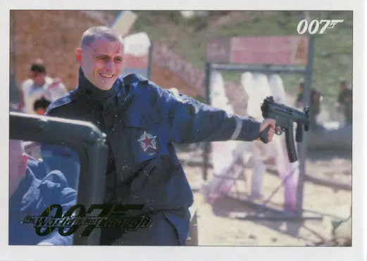 Man in a dark jacket holding a submachine gun in Gold Parallel Trading Card