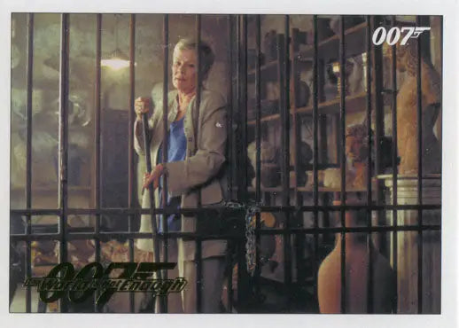 Man in a suit behind metal bars in James Bond 007 Classics Gold Parallel trading card