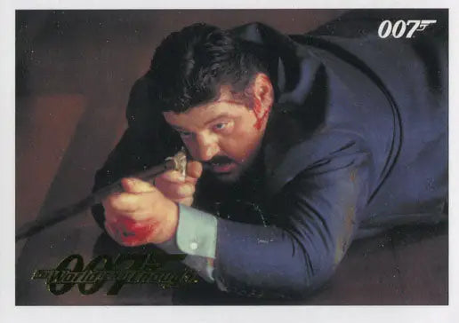 Man in dark suit aiming handgun in James Bond 007 trading cards gold parallel edition