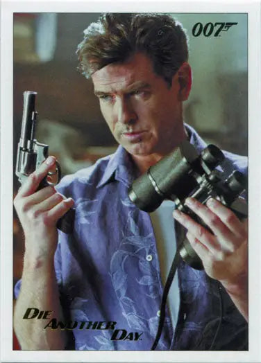 Man in blue shirt holding two handguns from James Bond Archives Gold Foil trading card