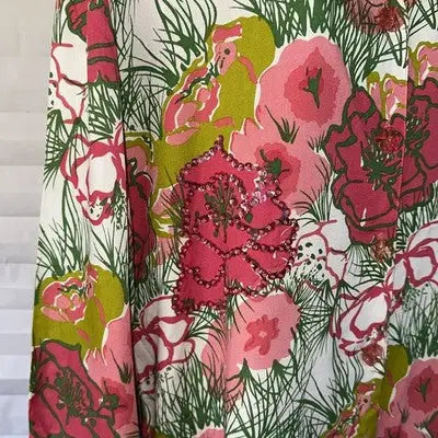 Pink floral sequin blouse with long sleeves in size large, vibrant floral fabric design