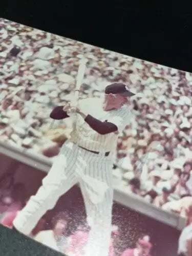 Baseball player swinging bat in Joe DiMaggio New York Yankees trading cards photo