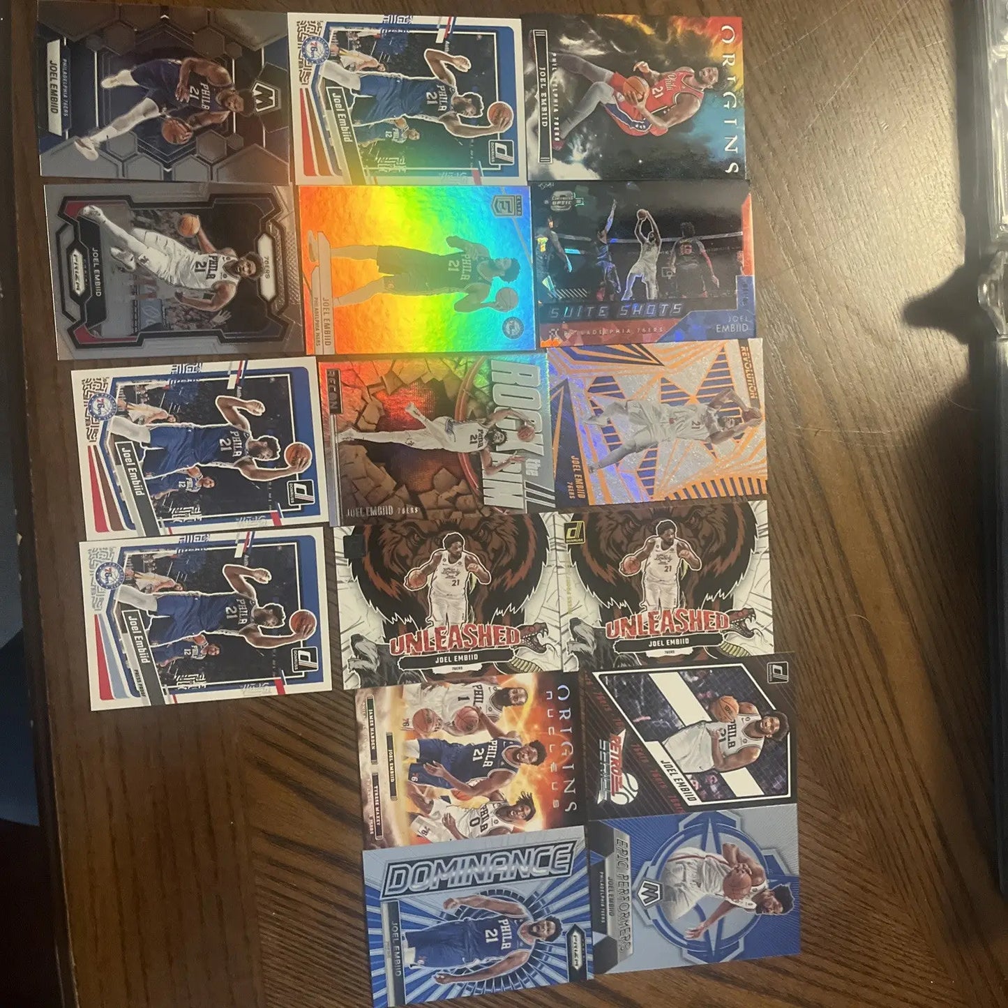 Collection of Joel Embiid trading cards in a premium card lot display