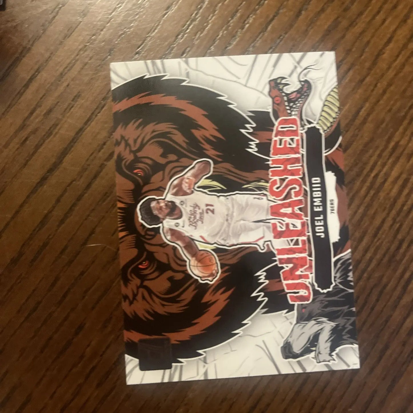 Joel Embiid Unleashed basketball card in Joel Embiid 16 Card Lot trading cards