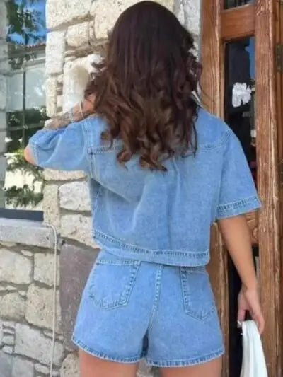 Woman from behind in a light wash denim Johnny Collar Short Sleeve Top and Skort Set