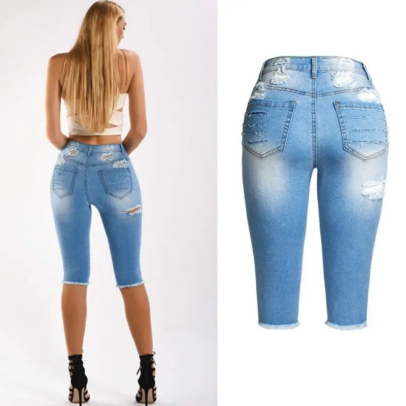 Light wash distressed denim capri jeans from Knee Length Destroyed Ripped Jeans collection