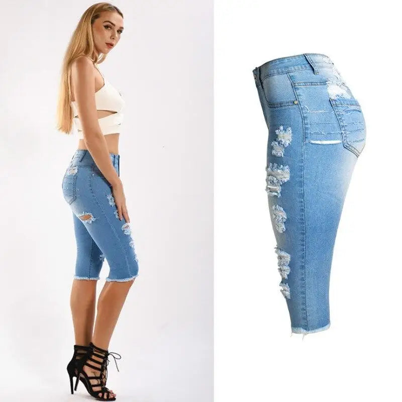 Light wash distressed capri jeans with ripped details from Knee Length Destroyed Ripped Jeans