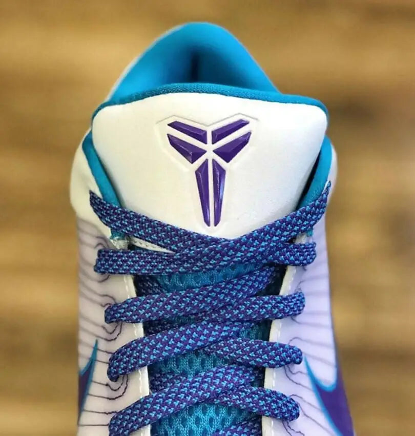 White and blue Kobe 4 Protro Draft Day Hornets basketball shoe with purple accents fast shipping