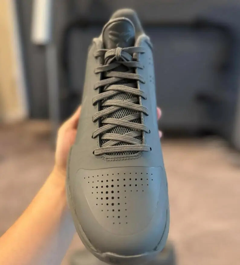 Gray Kobe 5 Fade To Black athletic shoe with perforated toe box, fast shipping available
