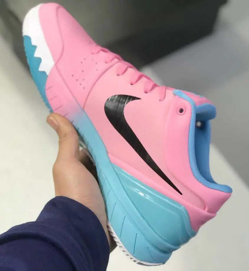 Pink and blue Nike Kobe 6 DeMar DeRozan athletic shoe with black swoosh logo for fast shipping