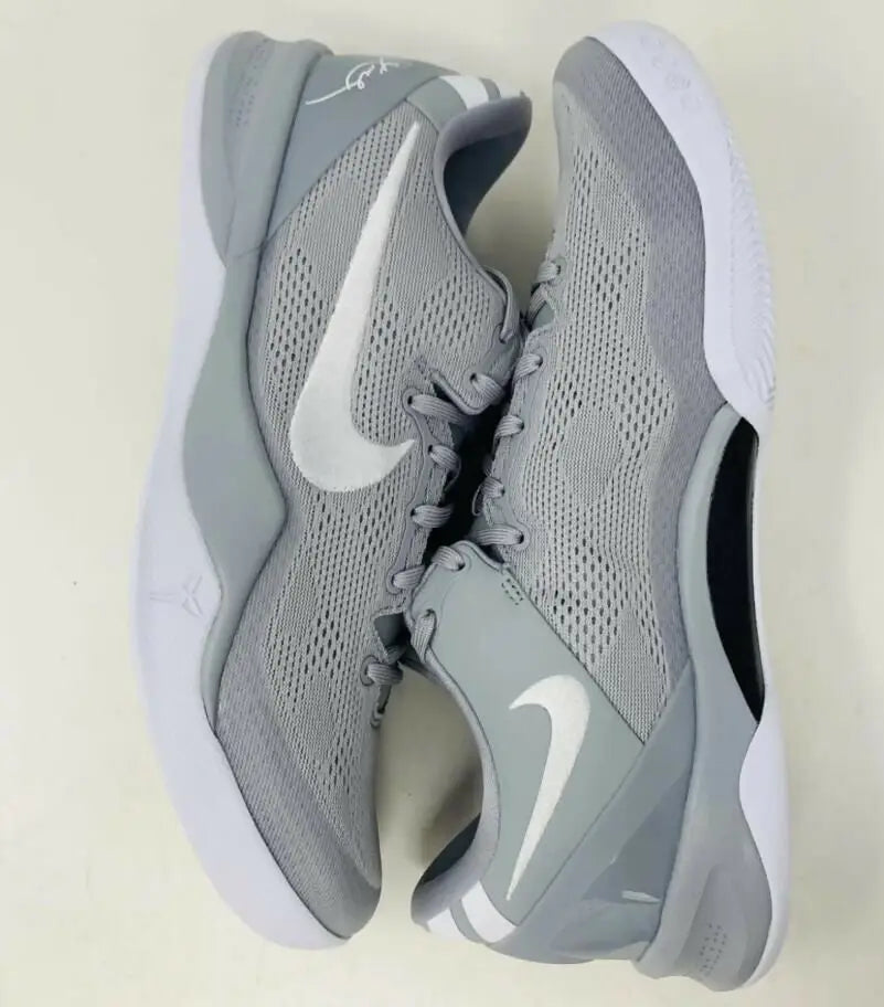 Light gray and white Nike Kobe 8 Protro Wolf Grey athletic shoes with mesh uppers and Swoosh logo for fast shipping