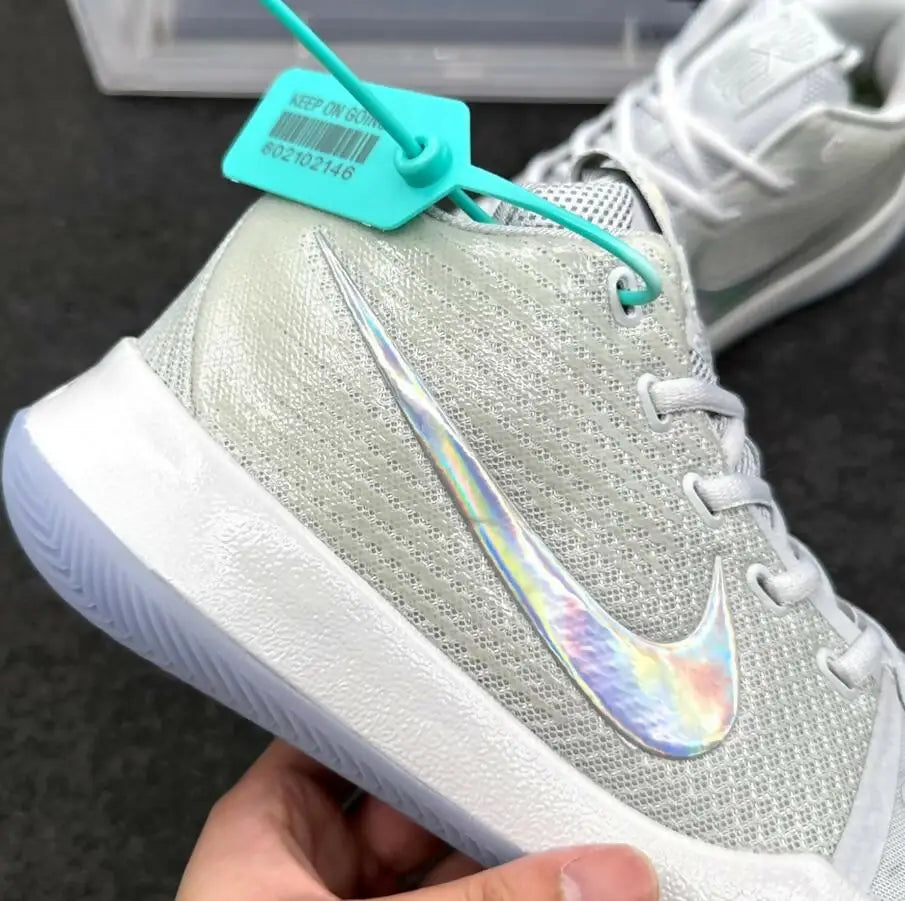Light grey Nike Kyrie 3 sneaker with iridescent swoosh and turquoise tag for fast shipping