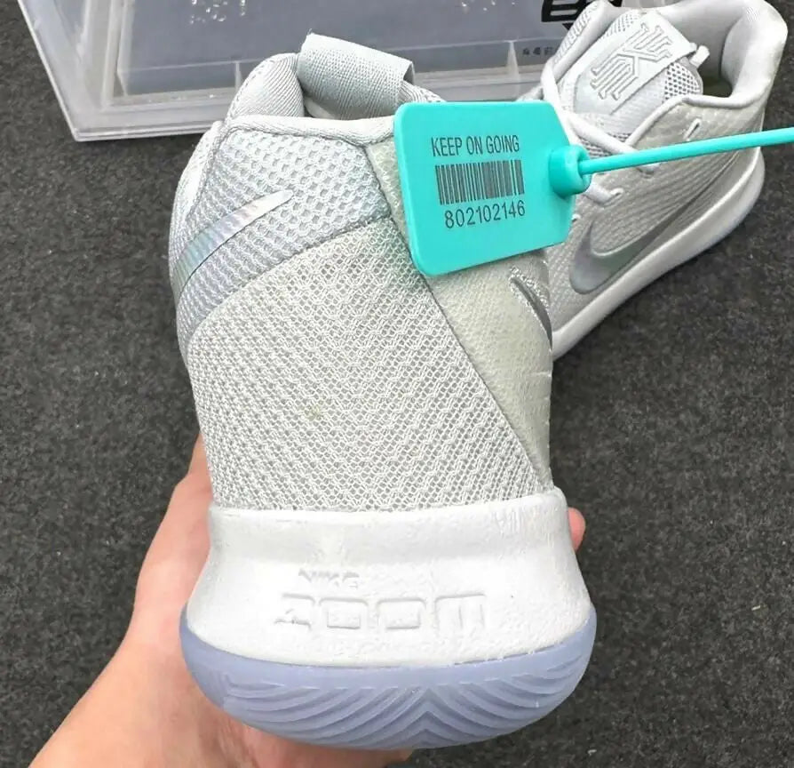 Light gray Nike Kyrie 3 sneaker with teal tag, fast shipping available in business days