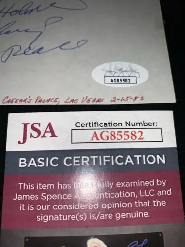 Larry Holmes autographed index card with JSA certification, World Heavyweight Champ 1983