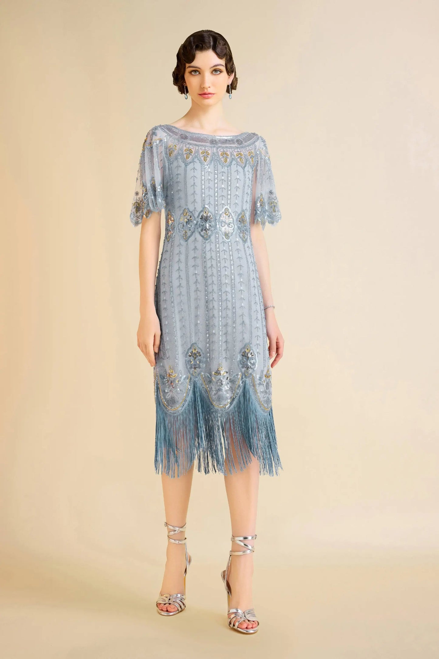 Sky blue beaded flapper dress with fringe and sequins, perfect for cocktail events