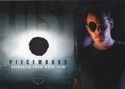 Alien face with large dark eyes on purple background for Lost Season 3 Pieceworks Costume Card