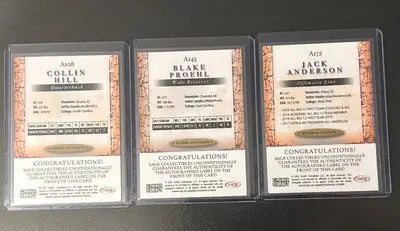 Three autographed football cards in protective cases from Sage Premier Draft Rookie series