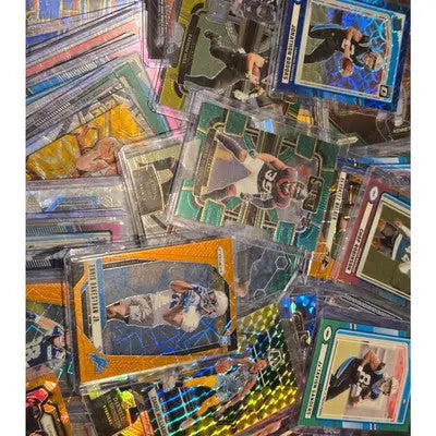 Collection of football trading cards in protective sleeves from a football card lot