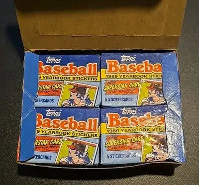 Open box of Topps 1989 Baseball Yearbook Stickers packs featuring colorful baseball yearbook stickers