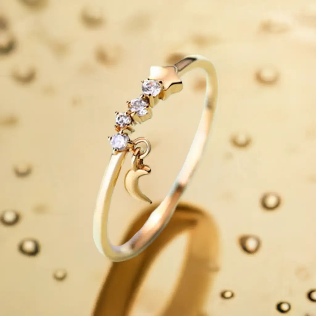 Luxurious 14K Gold Star Moon Ring with gemstones and crescent moon charm