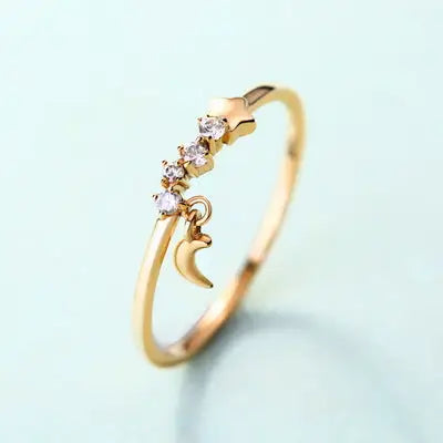 Luxurious 14K Gold Star Moon Ring with gemstones and celestial charms