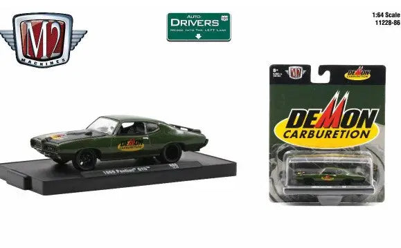 Dark green vintage Pontiac GTO model with Demon Carburetion packaging for collectors