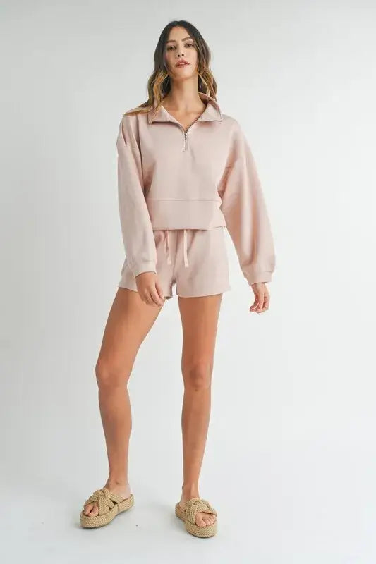 Light pink half zip sweatshirt and shorts set with woven slide sandals from Mable Apparel