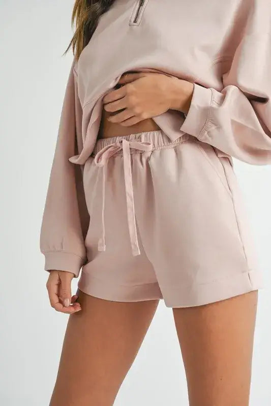 Light pink women’s half zip sweatshirt and shorts set from Mable Apparel, last few smalls