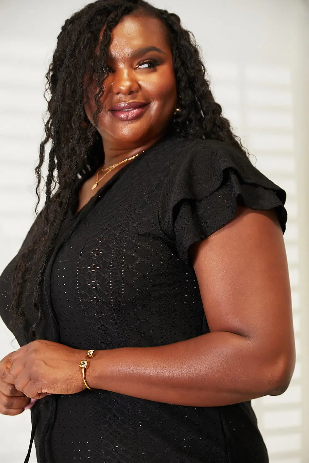 Black ruffled sleeve top with sequin detailing from Mandy Eyelet Tie-Neck Flutter Sleeve Blouse