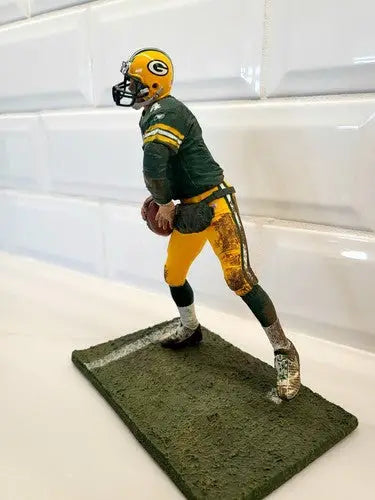 McFarlane Brett Favre Green Bay Packers figurine in green jersey displayed proudly