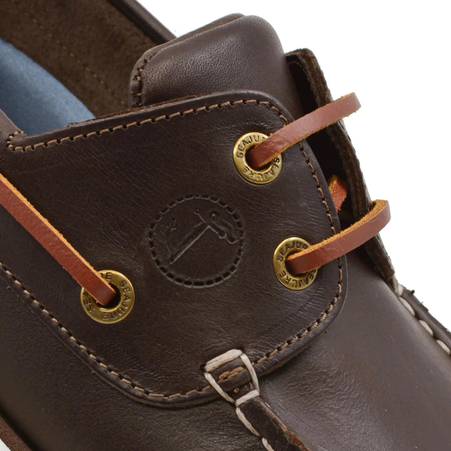 Close-up of high-quality men boat shoe Forvie with dark brown leather and gold-tone eyelets