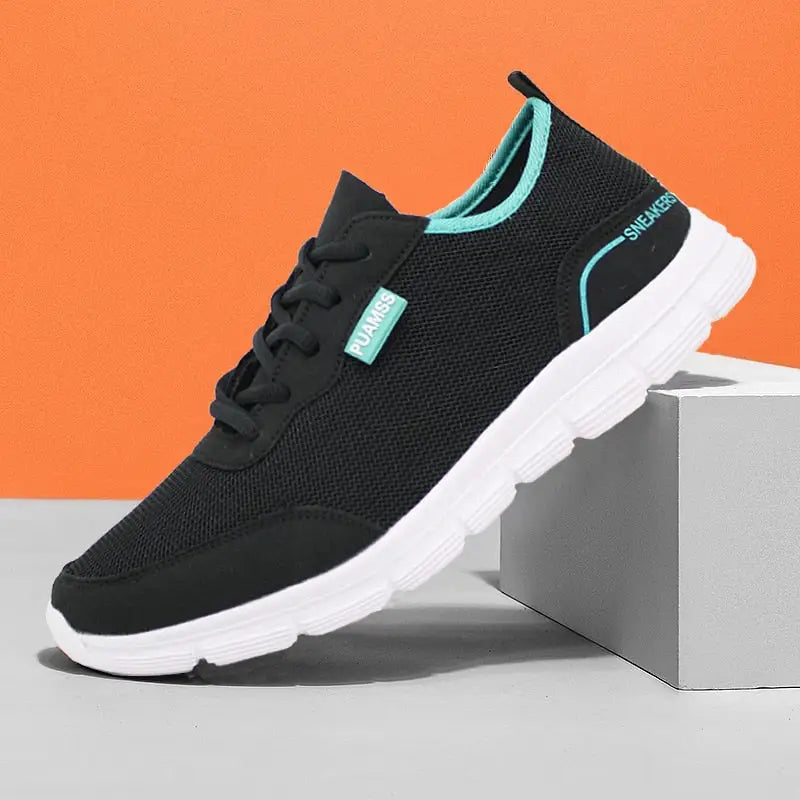 Men’s breathable mesh shoes with black mesh, teal accents, and white sole