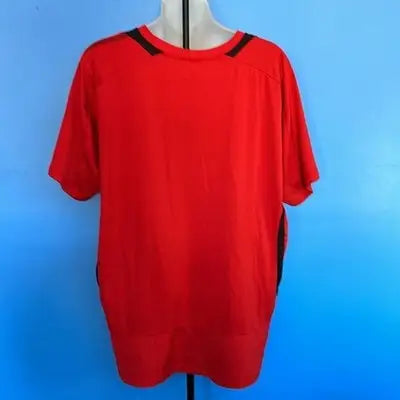 Red short-sleeve men’s soccer jersey with black trim on collar and sides, size XL