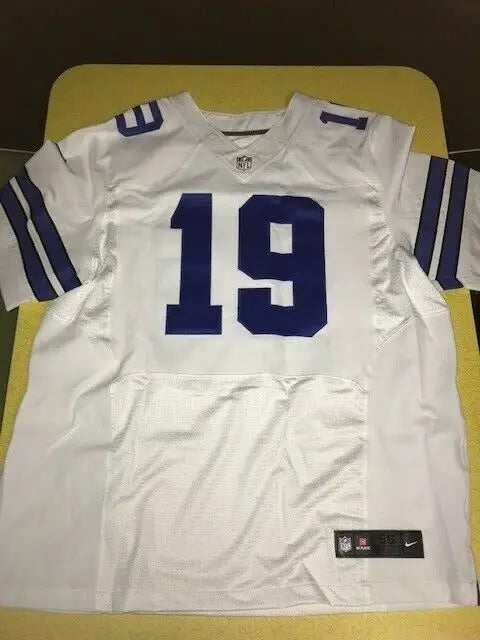 White Dallas Cowboys jersey with blue number 19, XXL size 56, autographed by Miles Austin