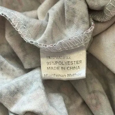 Garment care tag showing fabric composition and country of origin on Mirol paisley pattern dress size XXL