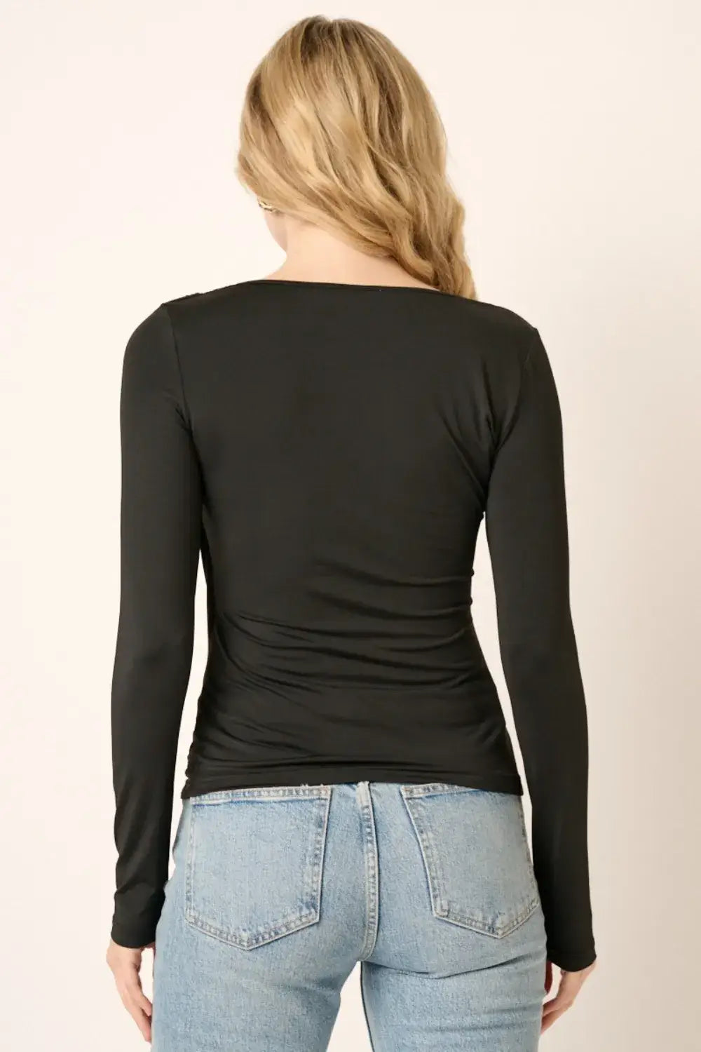 Black ruched long sleeve slim top with v-neck, ribbed cuffs, and stretchy jersey fabric