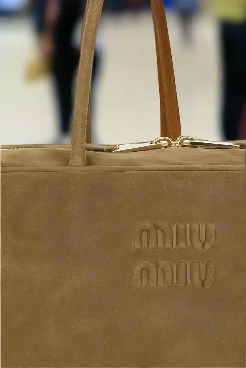 Miu Miu tan suede handbag with two top handles, timeless Italian luxury