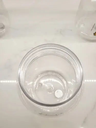 Empty clear plastic jar from Vintage Pittsburgh Pirates Plastic Jar Containers set