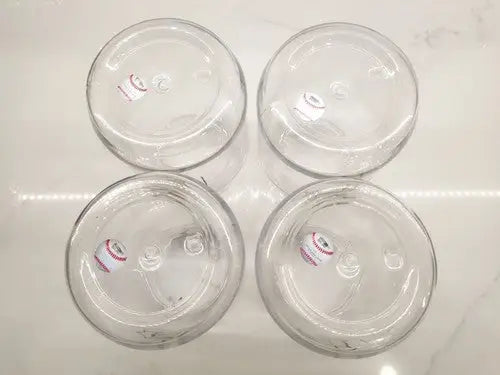 Four clear glass jars from the Vintage Pittsburgh Pirates Plastic Jar Containers set