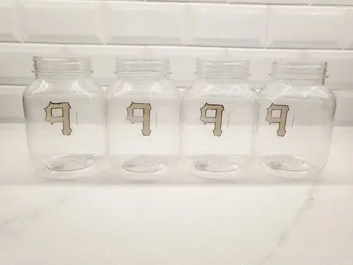 Four clear plastic jars in a set featuring Vintage Pittsburgh Pirates design