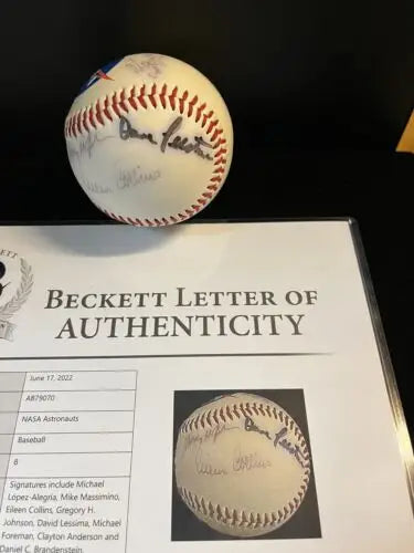 Autographed NASA baseball with authentication letter for collectors of trading cards