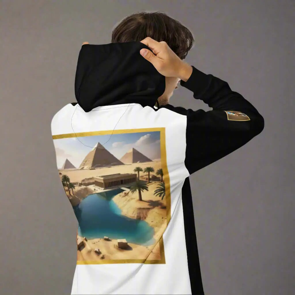 Person wearing a black and white Egypt unisex zip hoodie with desert scene graphic artwork