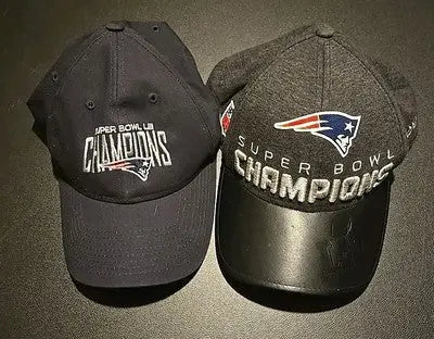 Two New England Patriots Super Bowl Champs hats in a lot of 2 showcasing Patriots Super Bowl champs