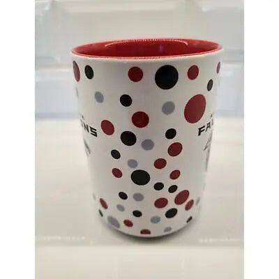 White ceramic coffee mug with red interior and unique polka dot pattern featuring NFL Atlanta Falcons